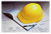 Builder's hard hat and plans
